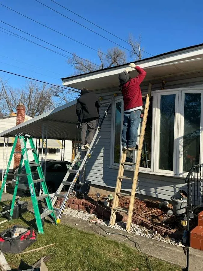 Restoration crew performing exterior repair in Saginaw